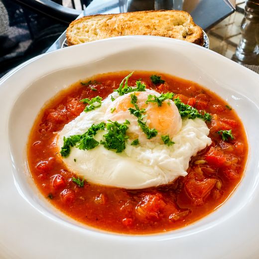 Poached eggs in tomato with grilled sourdough, also off the menu rather than the buffet.